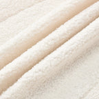 Poltrona d'accento in velluto verde/bianco/beige con braccioli rotondi, seduta singola