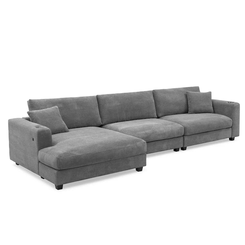 Divano componibile a L in velluto a coste grigio con chaise longue, portabicchieri e porte USB, 3-4 posti a sedere